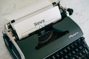 Close-up of an antique typewriter with 'News' on paper. News: SageVault Launches to Support Families with Real-Life Resources for Planning and Loss