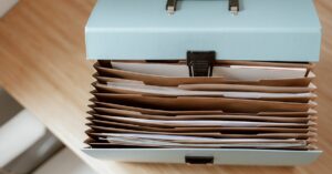 importance of estate planning - file storage folder on wooden table