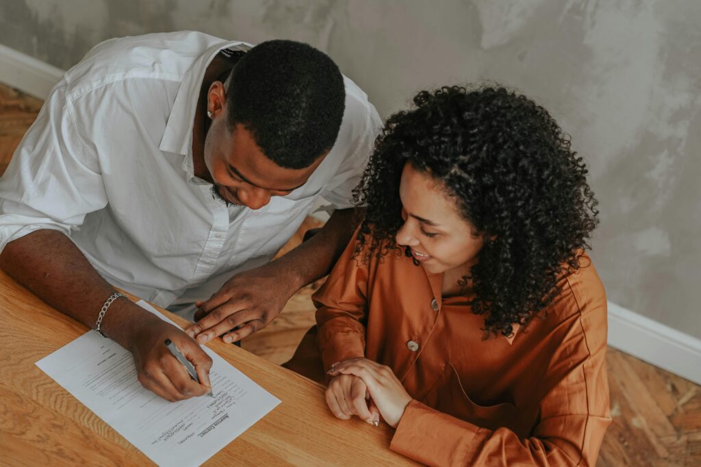 A couple signing a power of attorney document