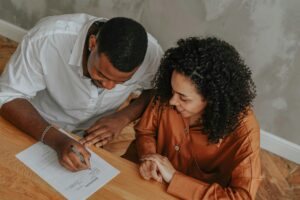 A couple signing a power of attorney document