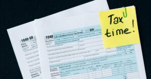 U.S. tax documents with a 'Tax time!' reminder, highlighting the importance of filing deadlines.