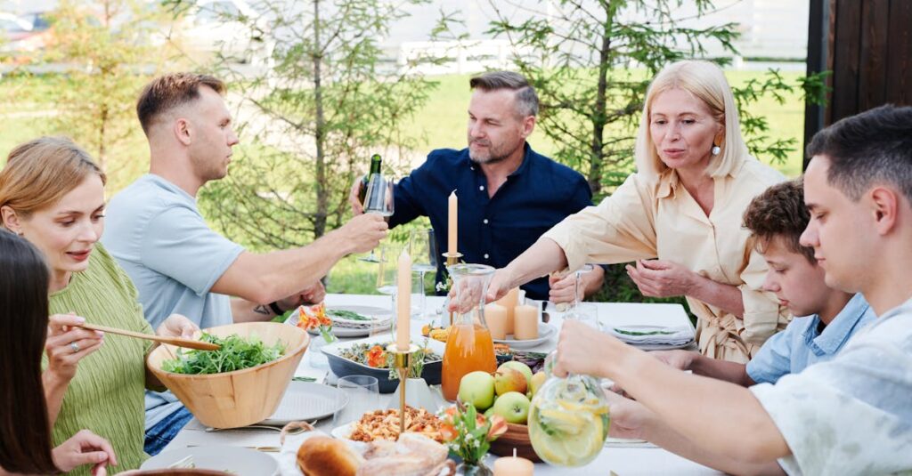 A cheerful family enjoying a delightful outdoor picnic with fresh food and drinks.